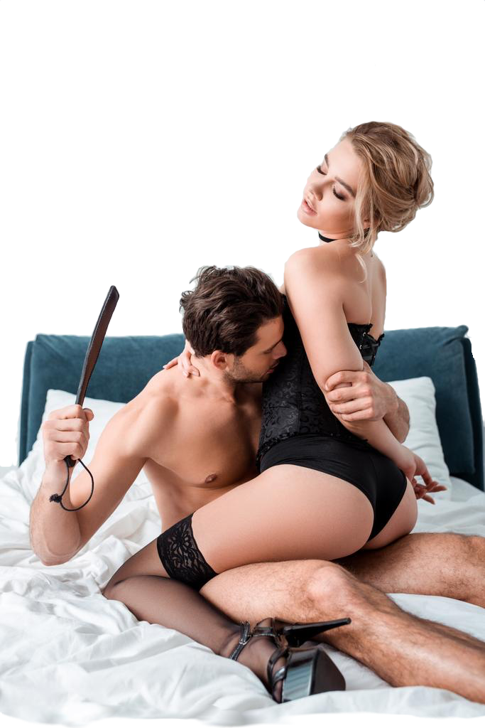 sexy couple spanking with paddle in bed